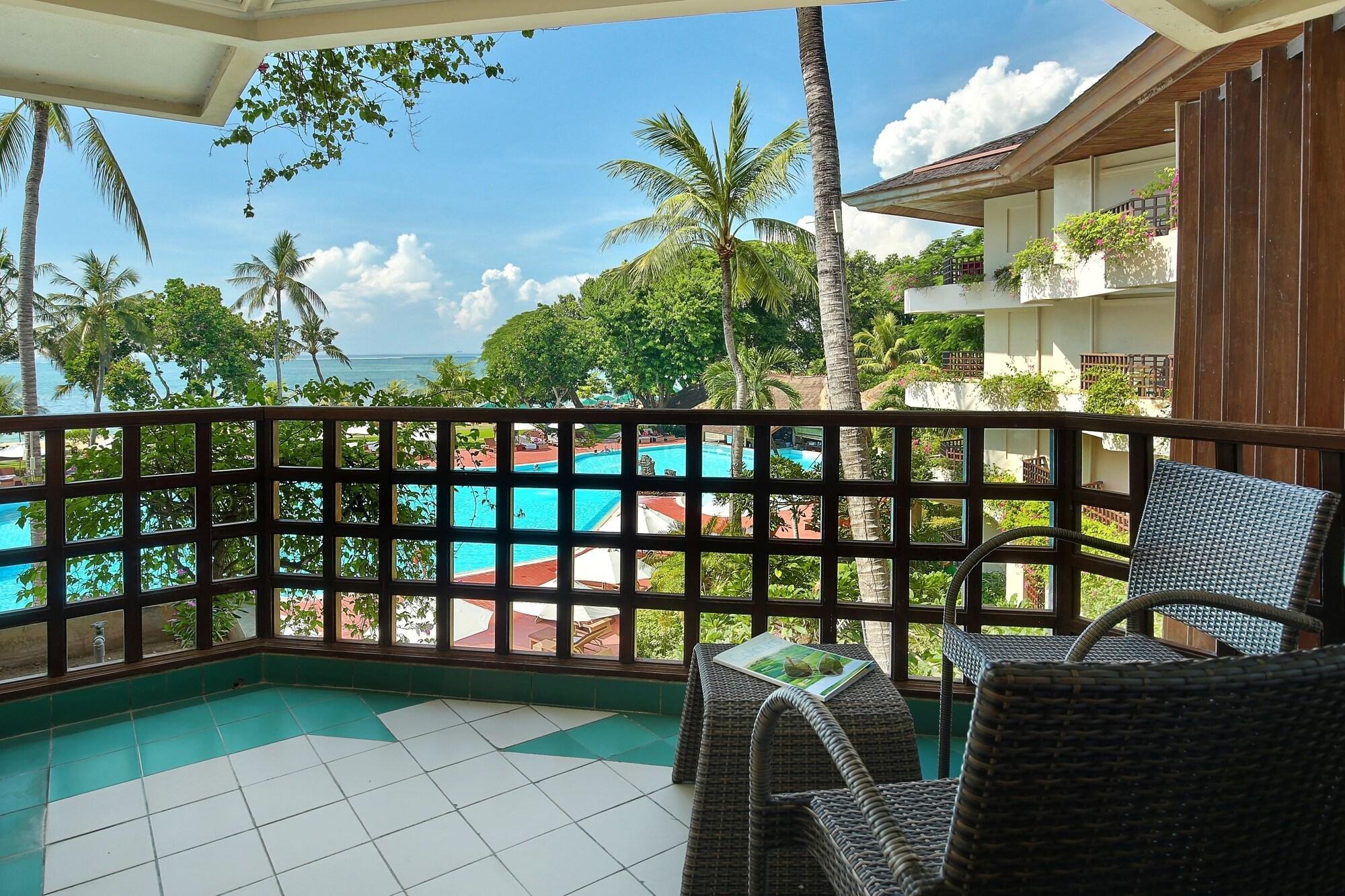Prama Sanur Beach Bali Kültér fotó A view of the pool at the resort